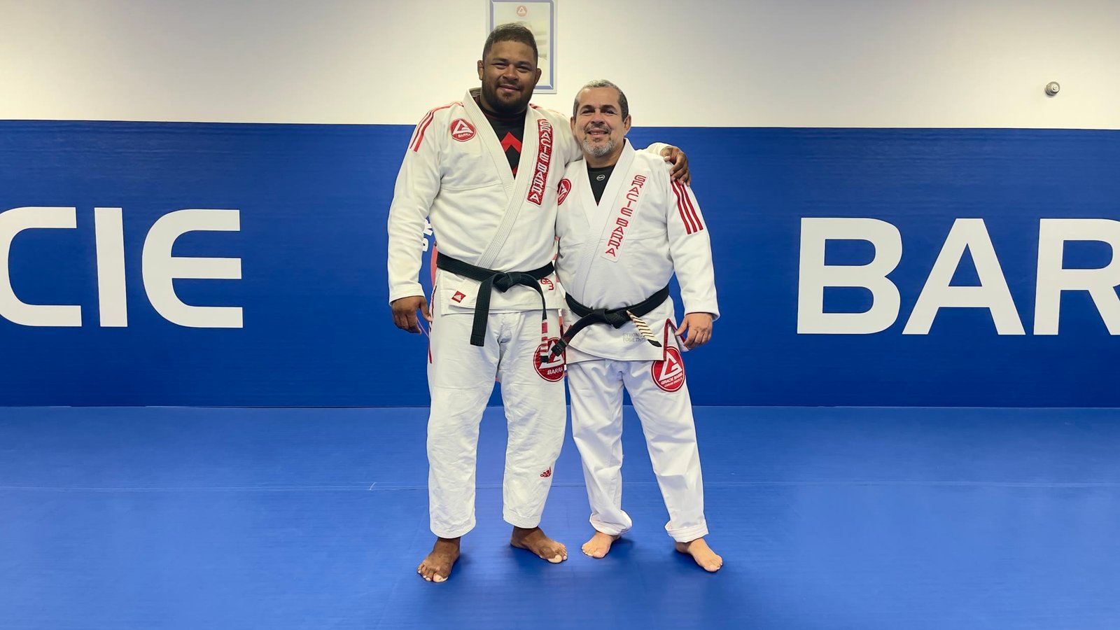 Thiago Reinaldo with Sensei Henrique Machado after a black belt degree promotion