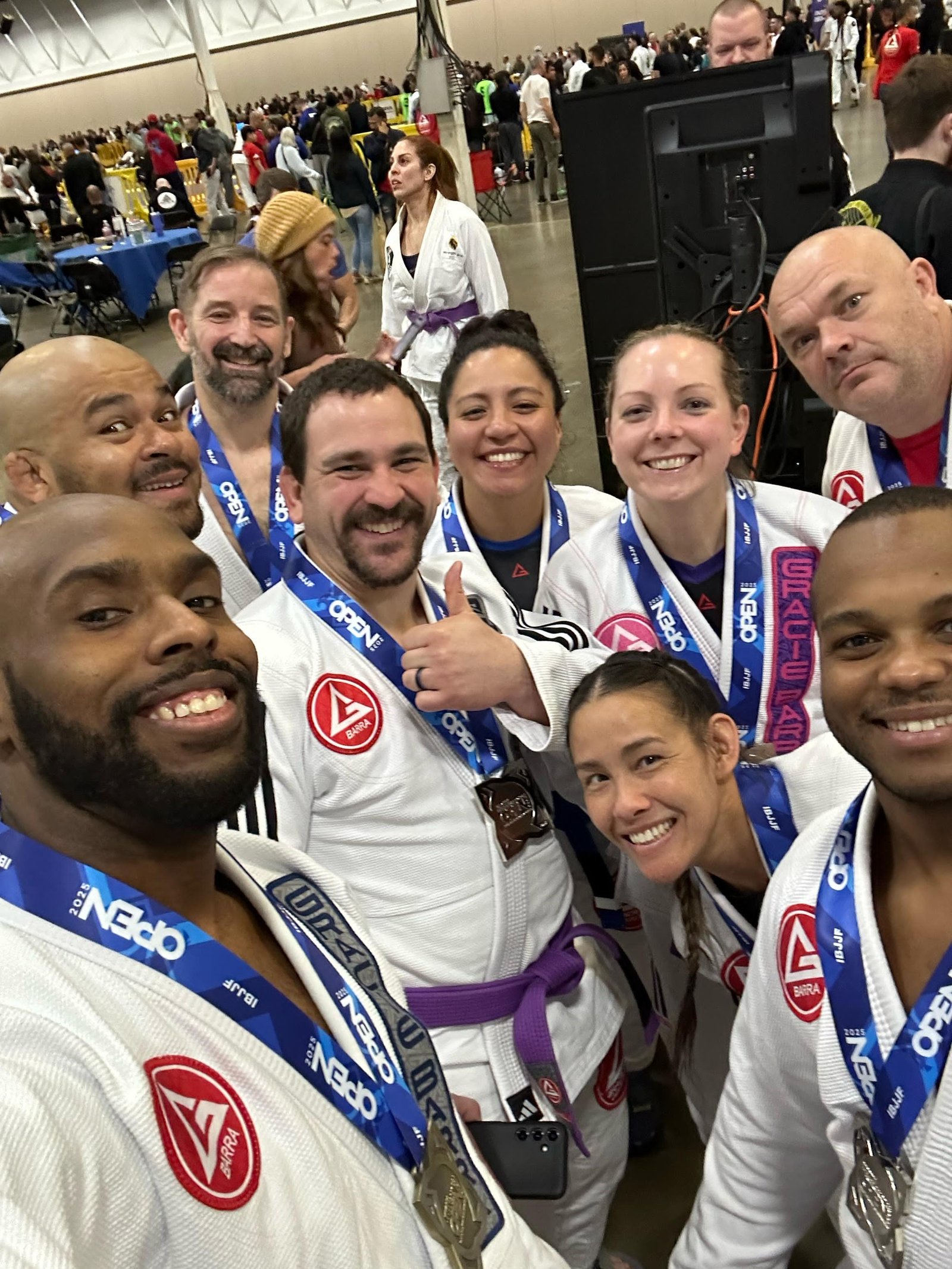 Gracie Barra Stafford teammates smiling together with their competition medals