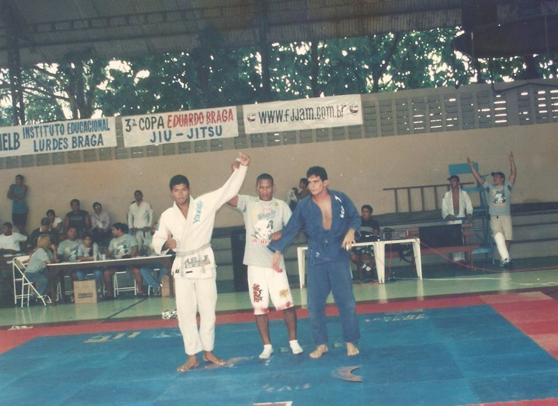 Young Thiago Reinaldo having his hand raised after a blue belt competition