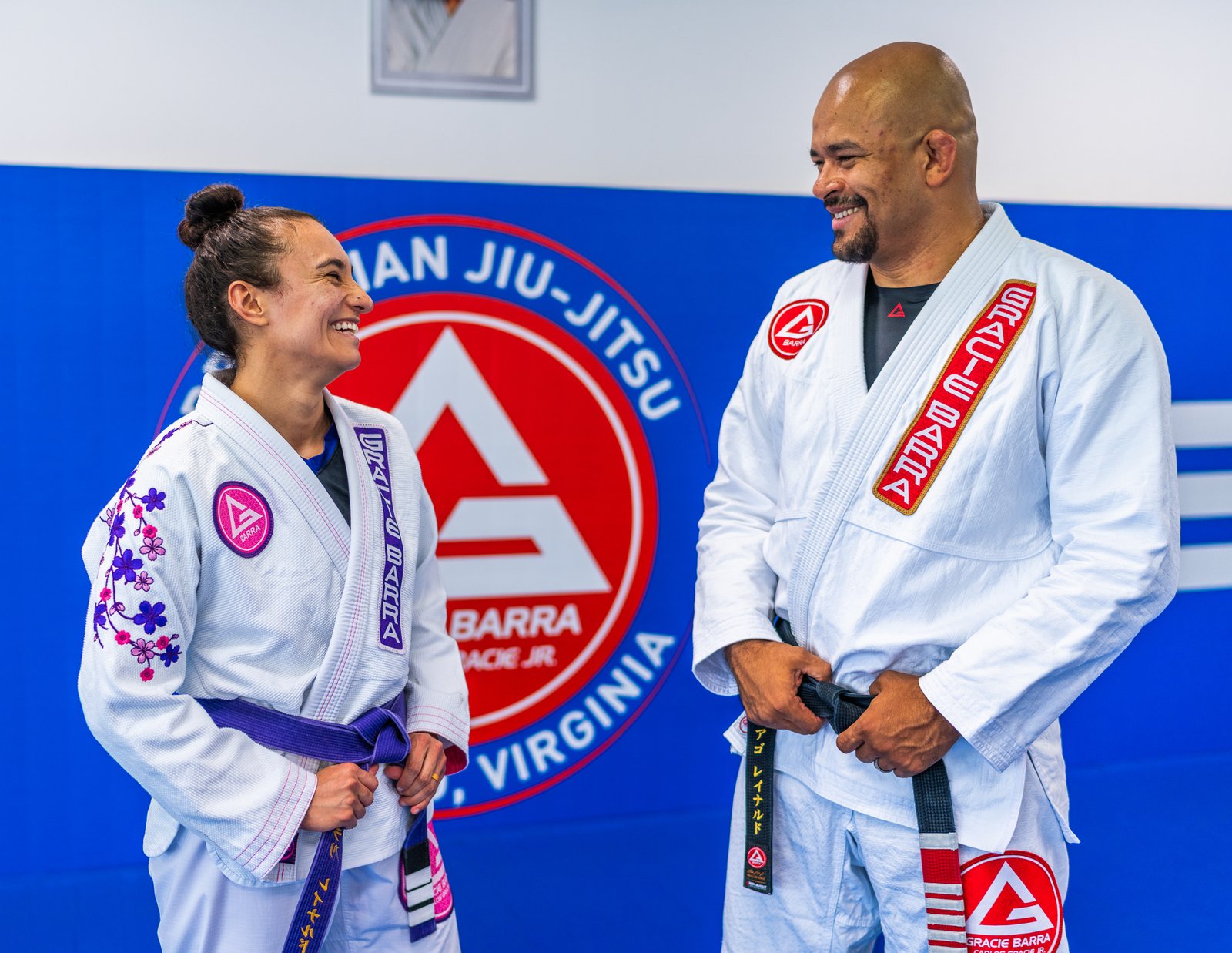 Thiago Reinaldo sharing a joyful moment with his wife on the mat
